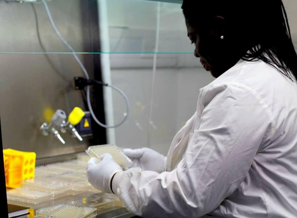 Picture of Cynthia working in a lab